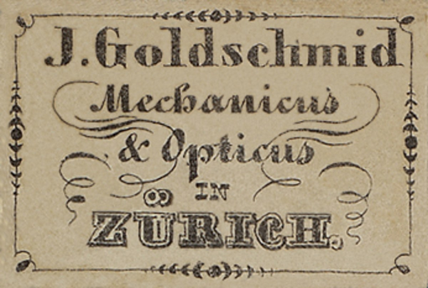Alte Visitenkarte für "J. Goldschmidt Mechanicus & Optics in Zürich", likely von Anfang des 20. Jahrhunderts, die die Dienstleistungen des Unternehmens auflistet.
